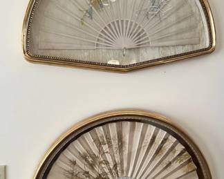 Two of several beautiful framed fans