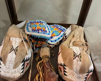 Antique Native American ceremonial moccasins and peace pipe