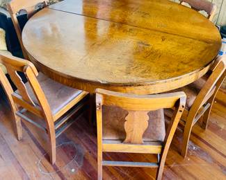 Antique round oak table with six chairs
