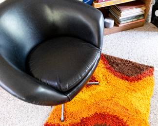 Overman Swivel Chair and Shag rug