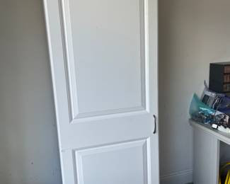 Tall white storage cabinet $50