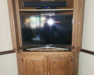 Corner entertainment armoire