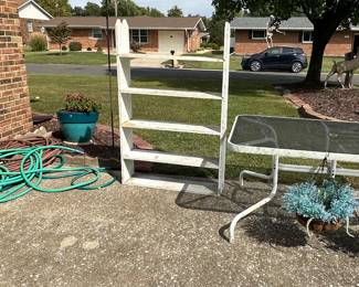 Garden Hoses; Wooden Shelf; Glass Top Patio Table