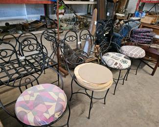 John Risley style picasso face wrought iron chairs