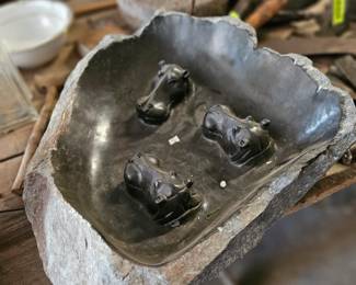 Stone hippopotamus bird bath