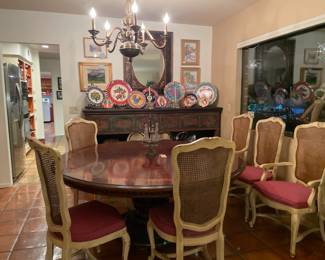 Large circular dining table with six chairs, large carved sideboard/console shelf