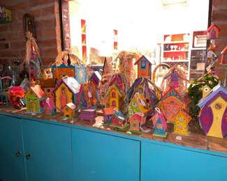 A large selection of hand painted birdhouses