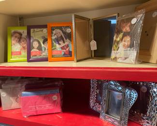 Photo frames, stationary, and a large collection of Mexican tin frames and ornaments