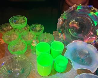 Vintage uranium glass collection – assorted tumblers, sherbet cups, bowls, divided dish, and serving pieces that glow under UV light, mixed with carnival and opalescent glass.