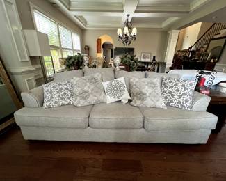 Grey couch with pillows