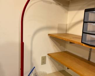 Arching red desk lamp by OFS Brands or similar.