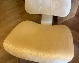 Eames molded plywood lounge chair with wood base.