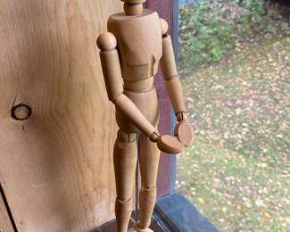 Wooden articulated poseable mannequin model.