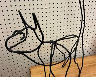 Wire cat sculpture.
