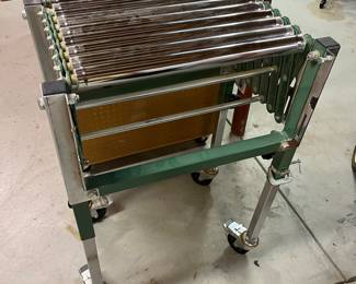 General International heavy roller flexible conveyor.