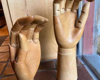 Two wooden articulated posing hands.