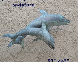 Outdoor metal dolphin sculpture