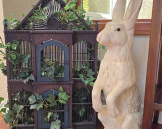 Ornate wooden bird cage, very large ceramic bunny