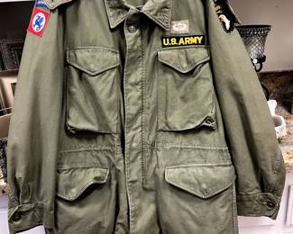 Vintage (Korean war era) M-1943 field jacket with US Army Airborne parachute patches