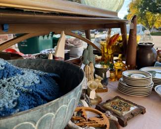Crochet blanket, scull, trivet, set of Tripoli dishes, footed metal bowl, saguaro bookends, ceramic cactus, amber Liberty Coin glassware.
