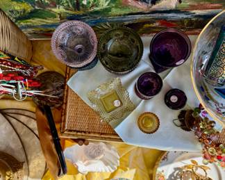 Original artwork, colored glassware, vintage beaded necklaces, vintage grapes, dinnerware, placemats. 