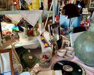 Edison records, Green art glass bottle, telephone, French mugs, bookends, handmade necklaces, antique hats, linens, etc.
