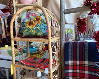 Mid Century daisy wicker shelf, vintage pillows, linens, blankets, ladder.
