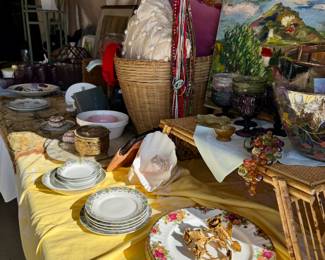 Original landscape painting, rose plates and rose napkin rings, European dinnerware, shells, colored glassware, Painted glass punch bowl, filigree and glass jewelry box, taffeta pillow, tasseled pillow.
