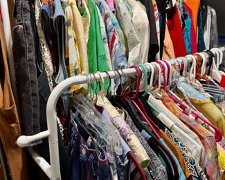 Racks (more than this photo) of vintage and designer clothing.