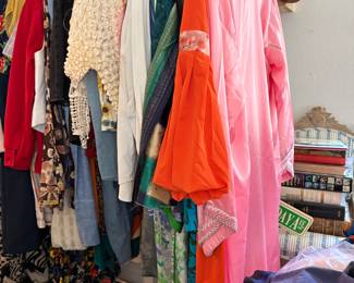 Racks of vintage clothes circa -1940's-1990's.