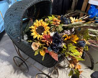 vintage buggy filled with flowers.