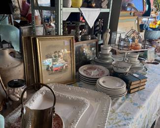 Antique prints, Italian platters, brass items, restaurant ware, books, colored glassware, crocks, jugs, mid century modern Madonna.