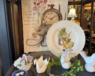 pretty vintage plates, swan figurines and basket