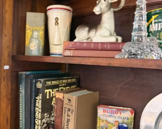 vintage Ram figurine, old books, bottles