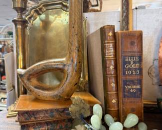 Vintage brass tray and books, jade grapes, book ends, brass candlesticks with globes