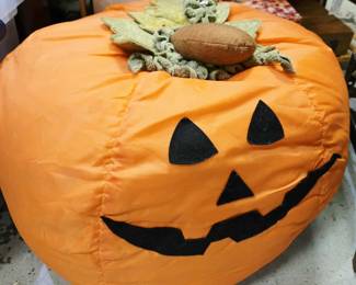 Pumpkin jack-o-lantern pouf