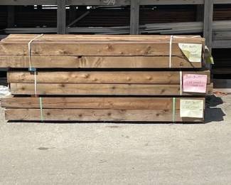 Various bundles of cedar lumber, different dimensions and quantities