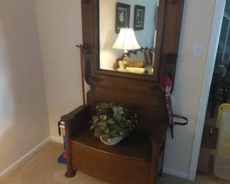 Walnut, beveled glass hallway tree with seat and storage