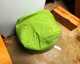 This is a square ottoman or a small kid sack