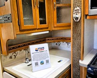 BID on this pristine motorhome. Come to the sale to see this motorhome and place bid at register. Just like the home this couple kept, immaculate. Photo of the details of this motorhome is in this listing. Please read the photo details for all the information on this 2004 Motorhome with 2 slide outs with 50K miles. Runs like a charm. So well taken care of. Sleeps 6 people. Dining turns into a bed and sofa turns into a bed and there is a slide out master bedroom. Bathroom with toilet and sink and then a separate shower. Plus the Burr Lift supports up to 4000 lbs!
