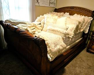 Like new as with all the furnishings throughout this home,, Queen sleigh bed and mattress. Lots of luxurious pillows.