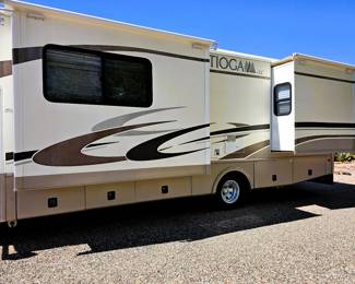 BID on this pristine motorhome. Come to the sale to see this motorhome and place bid at register. Just like the home this couple kept, immaculate. Photo of the details of this motorhome is in this listing. Please read the photo details for all the information on this 2004 Motorhome with 2 slide outs with 50K miles. Runs like a charm. So well taken care of. Sleeps 6 people. Dining turns into a bed and sofa turns into a bed and there is a slide out master bedroom. Bathroom with toilet and sink and then a separate shower. Plus the Burr Lift supports up to 4000 lbs!