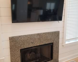 TV with bracket; gas fireplace insert