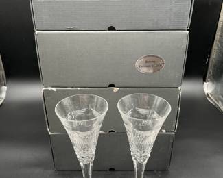 Several waterford stemware in boxes.