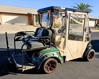 Golf Cart for sale. Come in and place a bid at the register. New 2025 enclosure, flip folding back seat, gas powered, totally street legal, headlights, tail lights, blinkers, 2014 refurbished. Runs beautiful!