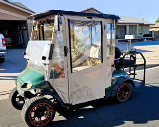Golf Cart for sale. Come in and place a bid at the register. New 2025 enclosure, flip folding back seat, gas powered, totally street legal, headlights, tail lights, blinkers, 2014 refurbished. Runs beautiful!