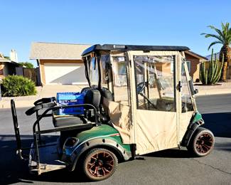 Golf Cart for sale. Come in and place a bid at the register. New 2025 enclosure, flip folding back seat, gas powered, totally street legal, headlights, tail lights, blinkers, 2014 refurbished. Runs beautiful!
