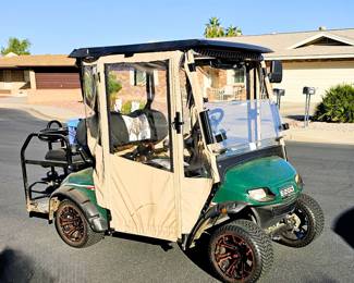 Golf Cart for sale. Come in and place a bid at the register. New 2025 enclosure, flip folding back seat, gas powered, totally street legal, headlights, tail lights, blinkers, 2014 refurbished. Runs beautiful!