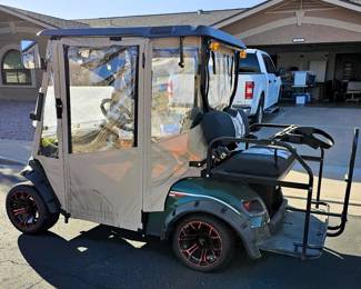 Golf Cart for sale. Come in and place a bid at the register. New 2025 enclosure, flip folding back seat, gas powered, totally street legal, headlights, tail lights, blinkers, 2014 refurbished. Runs beautiful!