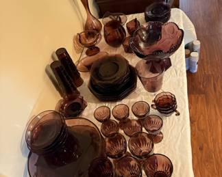 Amethyst dishes with serving pieces and tall vase